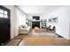 Bright living room featuring hardwood floors, a fireplace, and stylish decor at 6047 Guilford Ave, Indianapolis, IN 46220