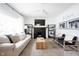Comfortable living room featuring a modern fireplace, plush seating, and stylish decor at 6047 Guilford Ave, Indianapolis, IN 46220