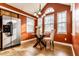 Charming breakfast nook with a modern glass table, flooded with natural light from large windows at 6432 Hunters Green Ct, Indianapolis, IN 46278
