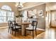 Stylish dining room with modern table set and access to the kitchen, perfect for entertaining guests at 6432 Hunters Green Ct, Indianapolis, IN 46278