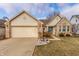 Charming single-Gathering home featuring a two-car garage, brick accents, and well-manicured landscaping at 6432 Hunters Green Ct, Indianapolis, IN 46278