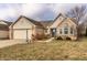 Attractive single-Gathering home with attached two car garage and manicured lawn with minimal landscaping at 6432 Hunters Green Ct, Indianapolis, IN 46278