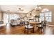 Inviting living space with natural light, a mix of seating options, and seamless flow to the dining area at 6432 Hunters Green Ct, Indianapolis, IN 46278
