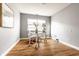 Bright office space featuring a glass desk, comfortable chair, and natural light from a large window at 6432 Hunters Green Ct, Indianapolis, IN 46278
