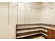 Walk-in closet with custom wood shelving offering ample storage space and organization at 6432 Hunters Green Ct, Indianapolis, IN 46278
