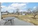 Large backyard features a wooden deck with a table and chairs, perfect for outdoor entertaining at 7344 Quartz Rock Rd, Indianapolis, IN 46236