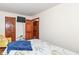 Cozy bedroom features a comfortable bed, TV, and access to other rooms at 7344 Quartz Rock Rd, Indianapolis, IN 46236