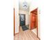 Welcoming foyer featuring a decorative light fixture, wood floors, and front door at 7344 Quartz Rock Rd, Indianapolis, IN 46236