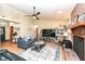 Relaxing living room featuring an open layout, brick fireplace, and view into the foyer at 7344 Quartz Rock Rd, Indianapolis, IN 46236