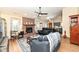 Comfortable living room with a brick fireplace, ceiling fan, and open layout at 7344 Quartz Rock Rd, Indianapolis, IN 46236