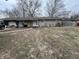 Ranch-style home with gray siding, a covered porch, and a walkway leading to the front door at 7643 S Delaware St, Indianapolis, IN 46227