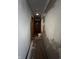 Interior hallway featuring wood-look doors and newly plastered walls at 7643 S Delaware St, Indianapolis, IN 46227
