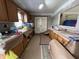 Kitchen with cabinets covered in preparation of painting at 7643 S Delaware St, Indianapolis, IN 46227
