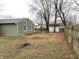 Backyard with green siding and privacy fence at 7824 Inverness Dr, Indianapolis, IN 46237