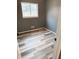 This bedroom has gray-painted walls and sleek, wood-look plank flooring at 7824 Inverness Dr, Indianapolis, IN 46237