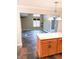 The kitchen opens to a living area with large windows, offering lots of natural light at 7824 Inverness Dr, Indianapolis, IN 46237