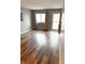 Living room with wood floors, neutral walls, and natural light streaming in from the windows at 7824 Inverness Dr, Indianapolis, IN 46237