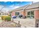 Patio with outdoor seating, grill, and a view of manicured yard and surrounding greenery at 8545 Olde Ml Trce, Indianapolis, IN 46260