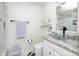 Contemporary bathroom featuring glass bowl sink, granite countertop, and sleek black and white accents at 8545 Olde Ml Trce, Indianapolis, IN 46260