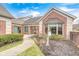 Inviting front exterior with a walkway, mature landscaping, and a cozy front porch at 8545 Olde Ml Trce, Indianapolis, IN 46260