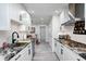 Modern kitchen with white cabinets, granite countertops, and stainless steel appliances at 8545 Olde Ml Trce, Indianapolis, IN 46260