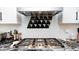 Kitchen features updated appliances, granite countertop, and decorative backsplash at 8545 Olde Ml Trce, Indianapolis, IN 46260