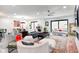 Bright, spacious living room with modern furnishings and large windows at 8545 Olde Ml Trce, Indianapolis, IN 46260