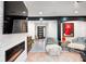 Open-concept living room has a fireplace, modern decor, comfortable seating and entryway views at 8545 Olde Ml Trce, Indianapolis, IN 46260