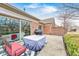 Cozy patio featuring a grill, outdoor furniture and peaceful views of yard and trees at 8545 Olde Ml Trce, Indianapolis, IN 46260
