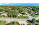 An aerial shot of the home in a neighborhood featuring tree-lined streets, manicured lawns and a residential setting at 908 Whispering Trl, Greenfield, IN 46140