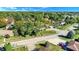 Aerial view featuring the property and surrounding suburban neighborhood with tree-lined streets and well-kept lawns at 908 Whispering Trl, Greenfield, IN 46140
