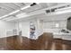 This partially finished basement offers hardwood floors, storage shelving, and flexible space at 908 Whispering Trl, Greenfield, IN 46140