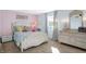 Cozy bedroom features a charming princess theme, a comfortable bed, and ample storage at 908 Whispering Trl, Greenfield, IN 46140