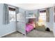 Bedroom with bunk beds, neutral carpet, and windows providing natural light at 908 Whispering Trl, Greenfield, IN 46140