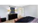 This cozy bedroom features a wooden dresser, carpeted floor, and blue walls for a peaceful retreat at 908 Whispering Trl, Greenfield, IN 46140