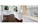 Bright kitchen features white cabinetry, and stylish decor at 908 Whispering Trl, Greenfield, IN 46140