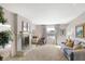 Cozy living room features a fireplace, plush seating, and natural light at 908 Whispering Trl, Greenfield, IN 46140