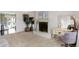 Spacious living room with a classic brick fireplace and ample natural light at 908 Whispering Trl, Greenfield, IN 46140