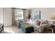 Comfortable living room with a large sofa, neutral carpet, and natural light at 908 Whispering Trl, Greenfield, IN 46140