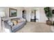 Open living room featuring hardwood floors that lead into an eat-in kitchen at 908 Whispering Trl, Greenfield, IN 46140