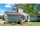 The home features an outdoor patio space and a sunroom with chairs, perfect for outdoor relaxation at 908 Whispering Trl, Greenfield, IN 46140