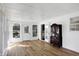 Bright sunroom featuring wood floors, lots of windows and natural light, and multiple exits at 908 Whispering Trl, Greenfield, IN 46140