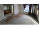 Bedroom with carpet, curtains, and open doorway to bathroom at 1017 Grovewood Dr, Beech Grove, IN 46107