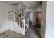 Open-concept entryway features a carpeted floor and a staircase at 1017 Grovewood Dr, Beech Grove, IN 46107