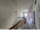 Second story hallway with lights, and a view to two rooms at 1017 Grovewood Dr, Beech Grove, IN 46107