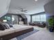 Large bonus room features carpet, seating, a queen-sized bed and bright windows at 10297 Anees Ln, Fishers, IN 46040