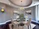 Stylish dining room features hardwood floors, contemporary decor, and a chandelier at 10297 Anees Ln, Fishers, IN 46040