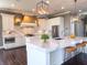 A modern kitchen with marble countertops, stainless steel appliances and pendant lighting at 10297 Anees Ln, Fishers, IN 46040