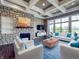 Inviting living room featuring a stone fireplace and comfortable seating at 10297 Anees Ln, Fishers, IN 46040