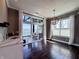 Bright living room with hardwood floors and sliding glass doors overlooking the backyard and lake at 10297 Anees Ln, Fishers, IN 46040